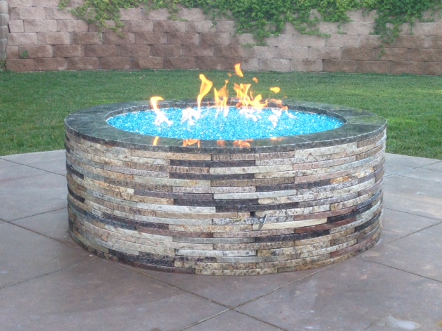 Bahama Blue Reflective installed in a fire pit with repurposed granite pavers